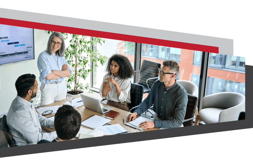 Group of people in professional attire having a meeting in a conference room