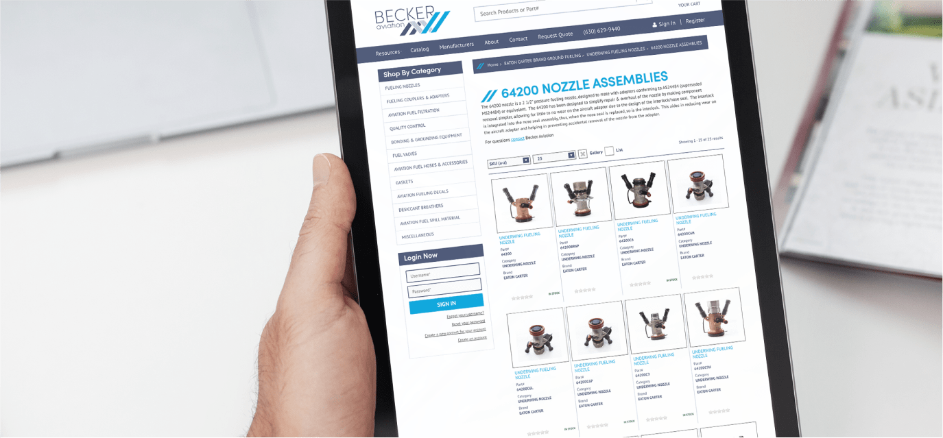 Hand holding a tablet displaying the Becker Aviation website