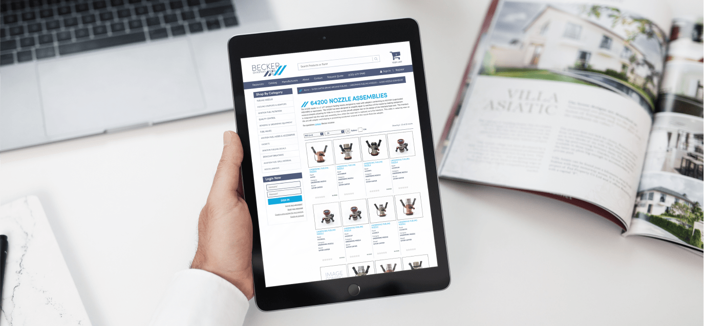 Hand holding a tablet that shows the Becker Aviation website