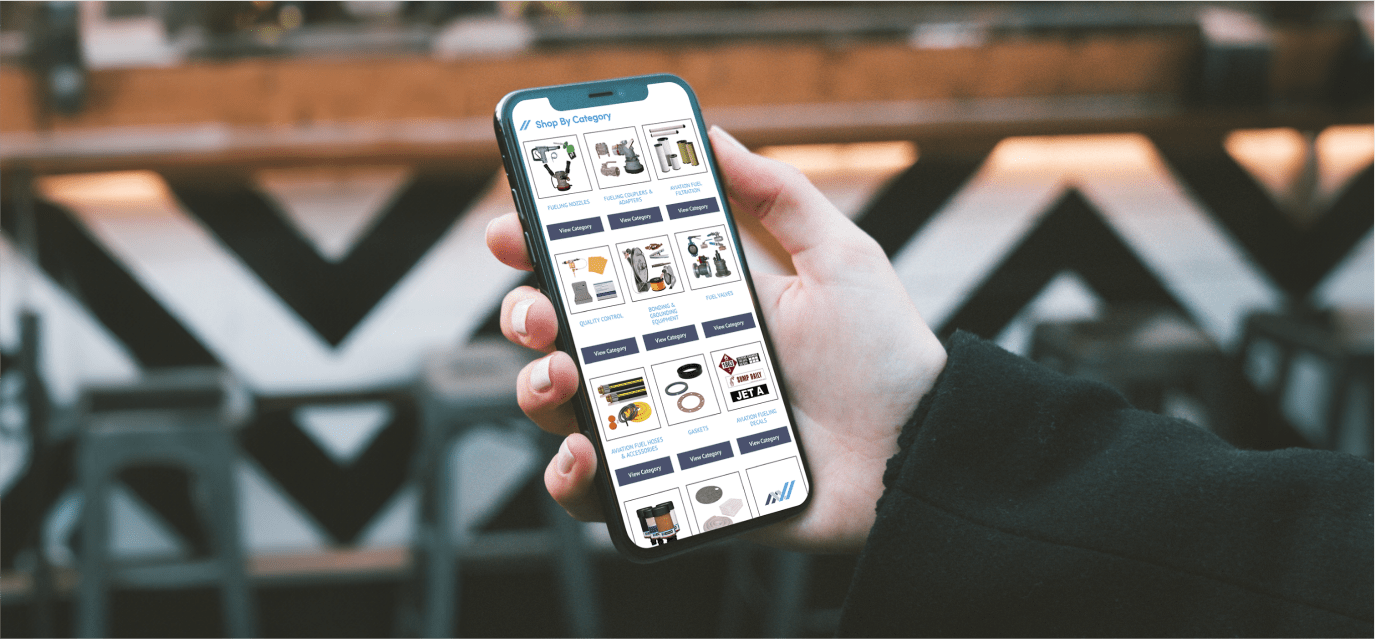 Hand holding a cell phone that shows a shopping website