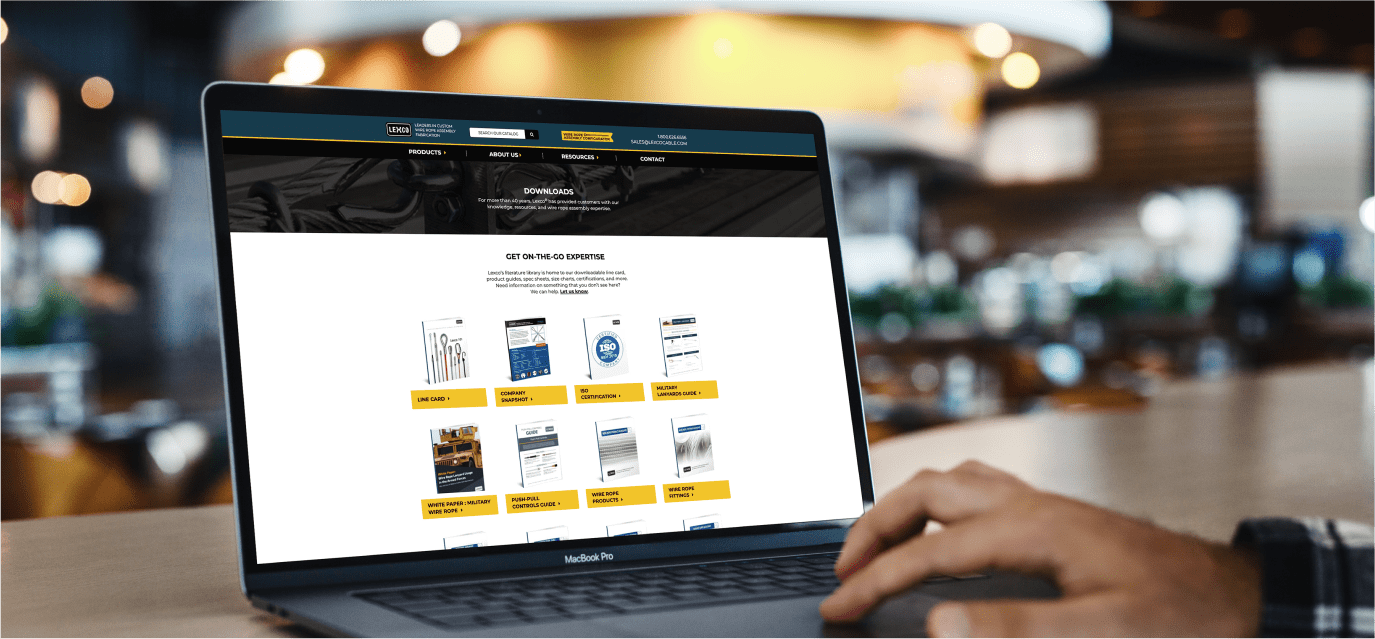 Person using a laptop, which shows the Lexco website