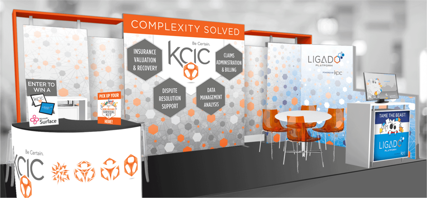 Digital rendering of a conference display booth, with sample banners and other marketing materials in orange and white